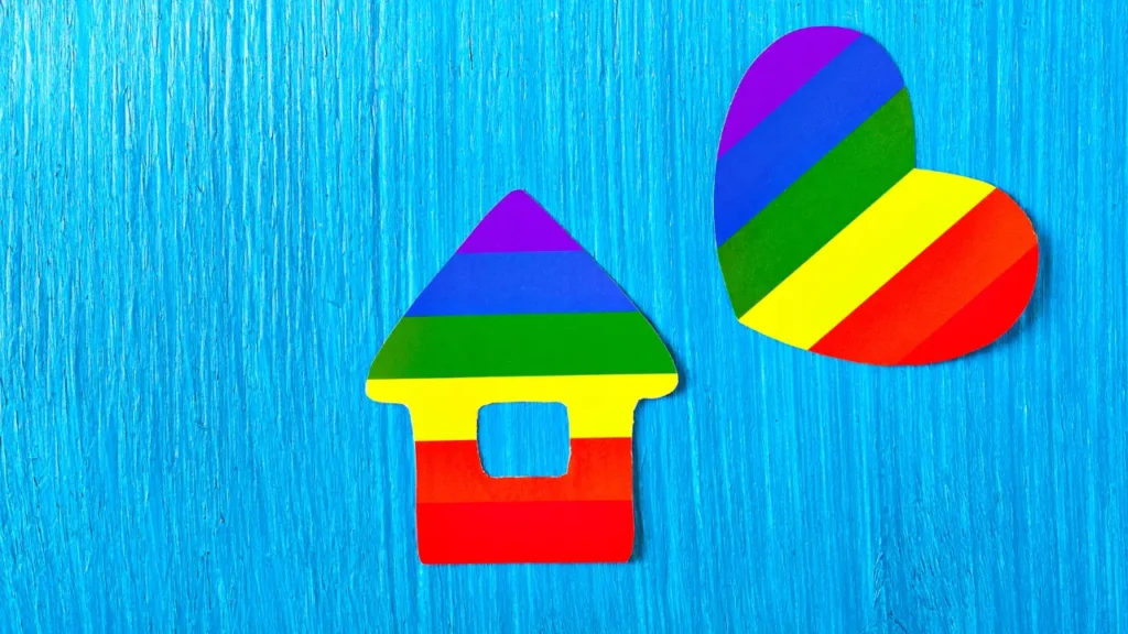 rainbow house and heart on blue background